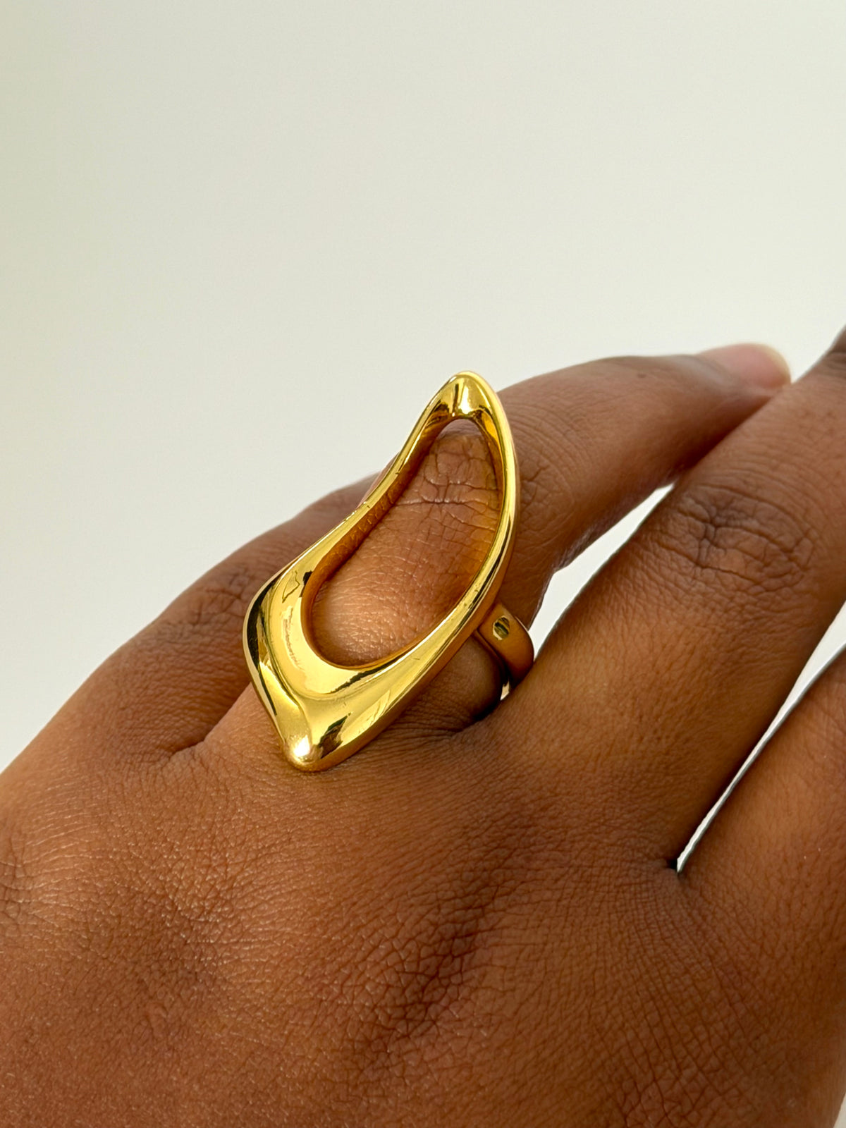 Alora gold statement ring worn on finger